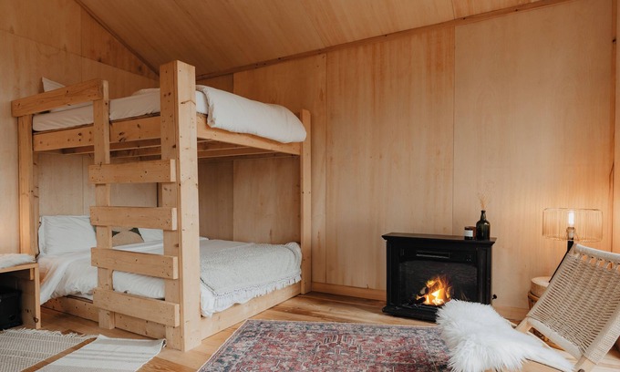 Liberty Cabin | Tiny cabin amongst trees on a farm with alpacas