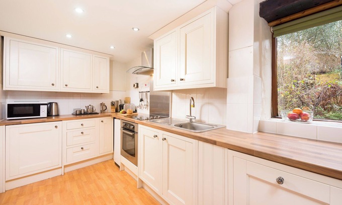 Berrynarbor Cottage | Traditional Byre Barn conversion with balcony off bedroom view North Devon Farm