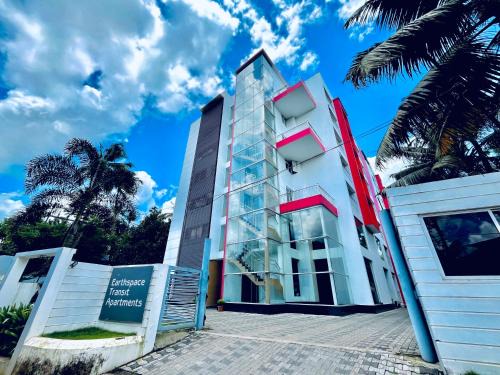 Nedumbassery Apartment | Transit suites by Habitat