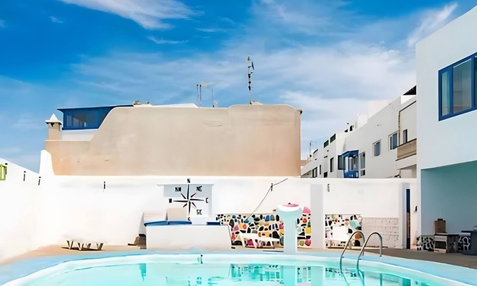 La Santa House | Vacation Home 'La Santa' with Sea View, Shared Pool and Wi-Fi
