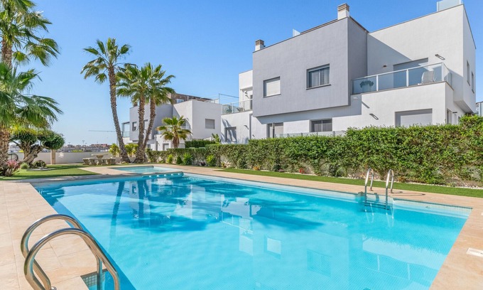 Orihuela Costa Villa | Villa Bahati close to the Beach with Sea View, Shared Pool, Garden, A/C & Wi-Fi