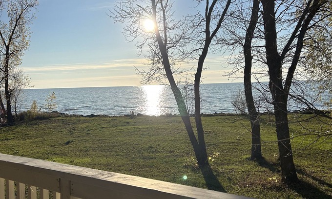 Saint Ambroise Cottage | Water's Edge cedar cabin on 1 acre lakefront: a perfect retreat summer or winter