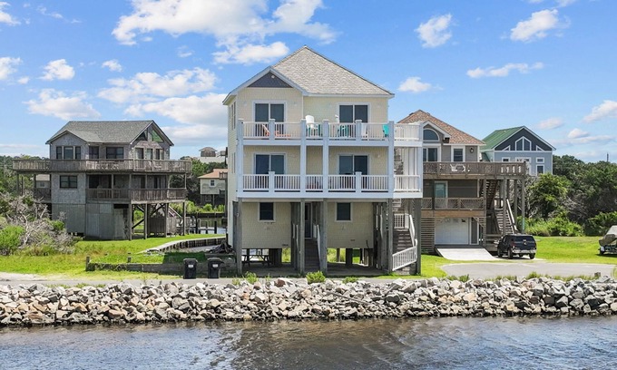 Frisco House | Waterfront home with boat dock, shared pool, & balcony with ocean view