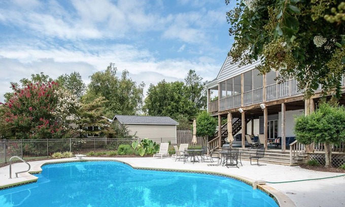 Dogue House | Waterfront home with swimming pool and tennis court.