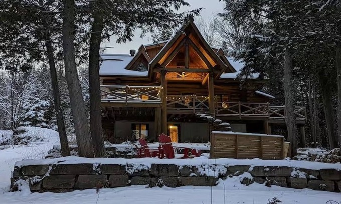 La Minerve Cottage | Waterfront Log Cottage with Hot Tub and Sauna