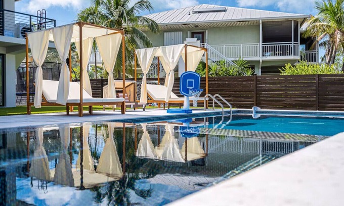 Rock Harbor Villa | Waterfront Luxe Pool, Hot Tub, Theater, Games and More!