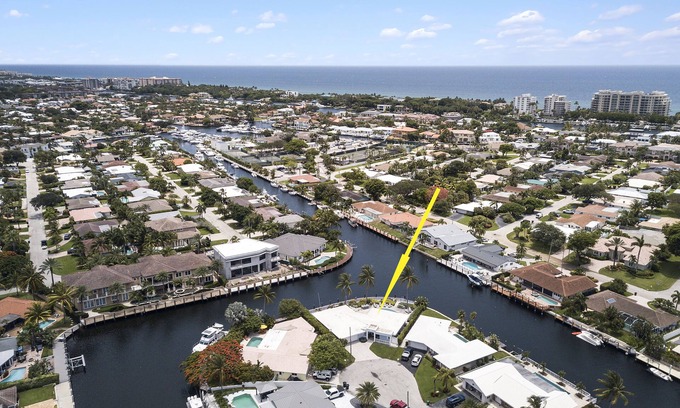 Lighthouse Point House | Waterfront retreat with heated pool, firepits, & boat access. C