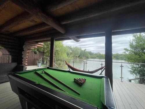 Tattershall House | Woodpecker Log Cabin with hot tub, pizza oven bbq entertainment area, lakeside with private fishing peg situated at Tattershall Lakes