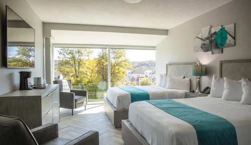 Luxurious Room w/ Two Queen Beds, 65'' TV, Complimentary Drinks - Non-smoking
