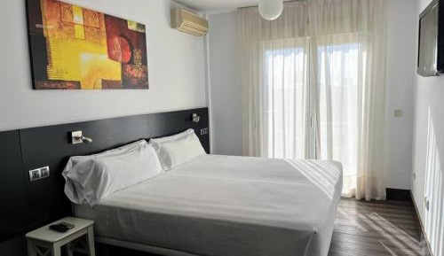 One-Bedroom Apartment double bed with balcony