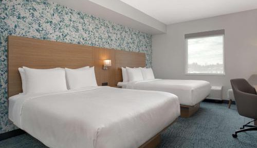 Efficiency Quadruple Room with Two Queen Beds - Non Smoking