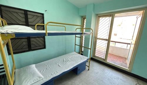 Single Bed in Dormitory Room