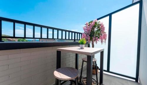 One-Bedroom Apartment with Balcony and Sea View