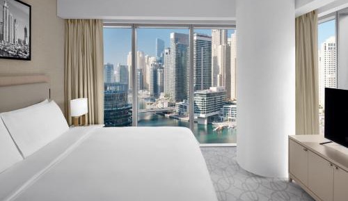 Premier Marina View Suite, King bed, Sofa bed, Club lounge access with Breakfast, Lunch & Dinner, 4PM Late checkout, Including direct access to Dubai Marina Mall & Marina Walk   