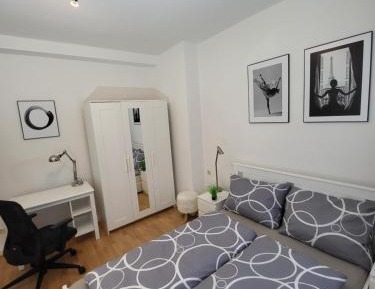 One-Bedroom Apartment with Balcony and City View