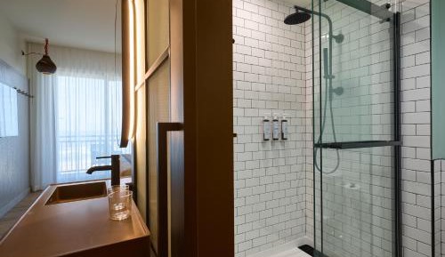 Moxy Quad Room with Four Queen Bunk Beds and Balcony