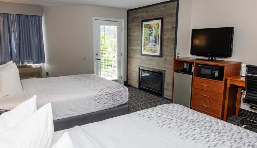 Queen Room with Two Queen Beds w/ fire place & private balcony