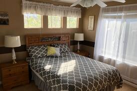 Vista Ridge House | Mountain Views! Bedroom with private bathroom.