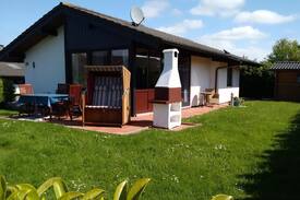 Großwurden House | Ferienhaus Eul J 4 mit Wintergarten und Specksteinofen, Waschmaschine und Trockner direkt an der Nordseeküste, WLAN