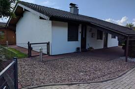 Großwurden House | Ferienhaus Eul J 4 mit Wintergarten und Specksteinofen, Waschmaschine und Trockner direkt an der Nordseeküste, WLAN