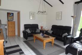 Großwurden House | Ferienhaus Eul J 4 mit Wintergarten und Specksteinofen, Waschmaschine und Trockner direkt an der Nordseeküste, WLAN