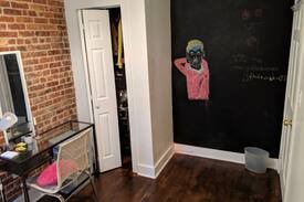Bedford-Stuyvesant Apartment | Beautiful room with a brick wall