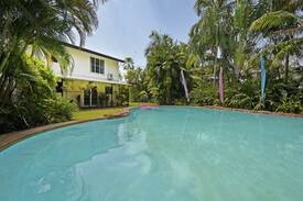 Fannie Bay House | Fannie Bay - Queen bedroom with resort pool