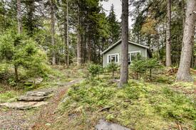 Southport Cabin | Cozy, dog-friendly cabin w/ a wood burning fireplace & a full kitchen