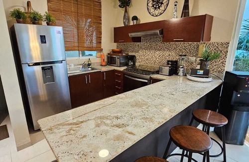 Zazil-ha Condo | Condo Private Rooftop Jacuzzi Steps from the Beach