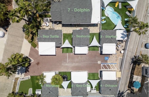 Madeira Beach Cottage | The Cottages of Madeira Beach, Located Across from the Sand. Heated Pool, and Walk to Johns Pass.