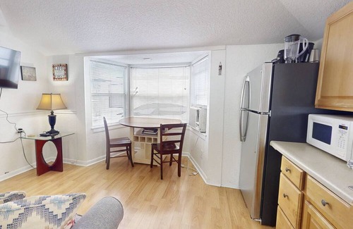 Madeira Beach Cottage | The Cottages of Madeira Beach, Located Across from the Sand. Heated Pool, and Walk to Johns Pass.