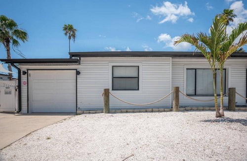 Madeira Beach Cottage | The Cottages of Madeira Beach, Located Across from the Sand. Heated Pool, and Walk to Johns Pass.