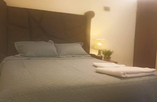 Puno House | Cozy room with TV and private bathroom
