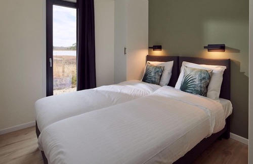 Lattrop House | The six-person holiday villa Amalia with private sauna has a spacious living room, open kitchen, three bedrooms and a spacious patio.