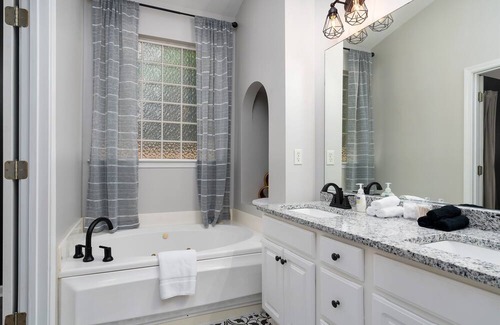 Alabaster House | Enjoy a Gardenside Getaway - Fenced Yard & Patio