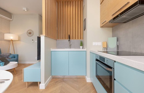 Mokotow Apartment | Bright Blue Apartment by Renters