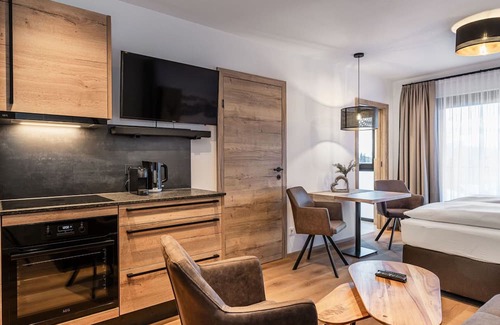 Kirchberg in Tirol Apartment | Cosy apartment for 4 guests with WIFI, pool, TV and terrace