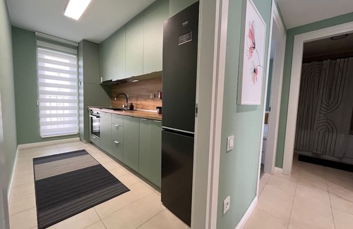 Stefanestii de Jos Apartment | Cosmopolis Family Apartment - Pools & Gym
