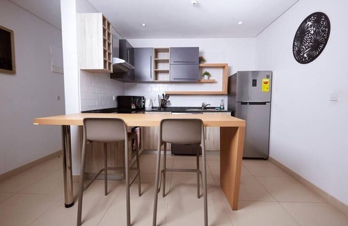 East Legon Apartment | Chic 1-bedroom apartment in marvelous Accra with fitness room, AC