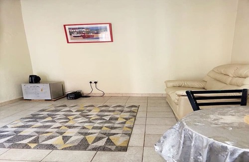 Kololi Apartment | Serene Room and Living Room