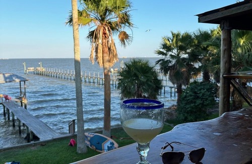 Dickinson House | Charming 2-bedroom house with hot tub and dock right on the San Leon bay