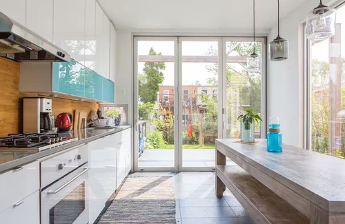 Kensington House | Spacious, artful 4-bedroom house in Brooklyn with lush backyard, parking, A/C