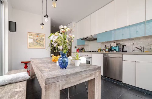 Kensington House | Spacious, artful 4-bedroom house in Brooklyn with lush backyard, parking, A/C