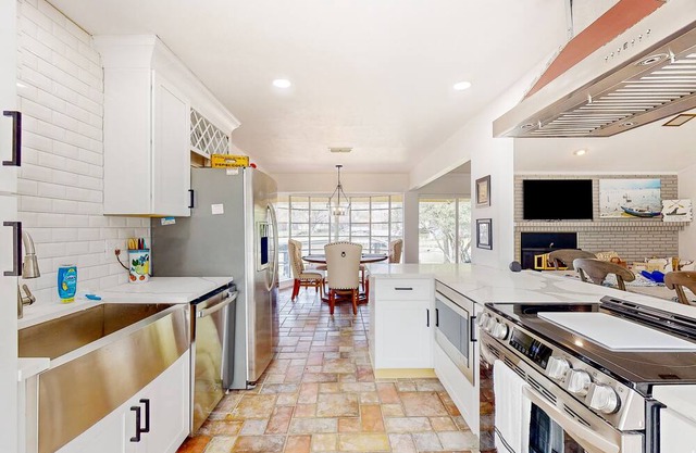 Lakefront, dog-friendly home with dock, kayak, great yard & prime location