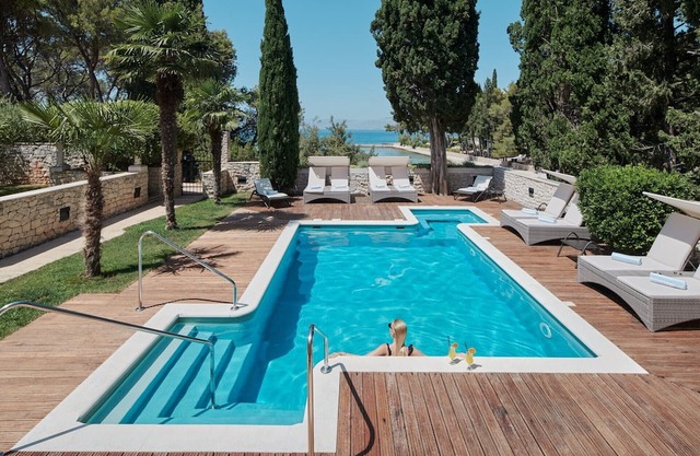 Villa Diocletian's Palace with a pool near the sea