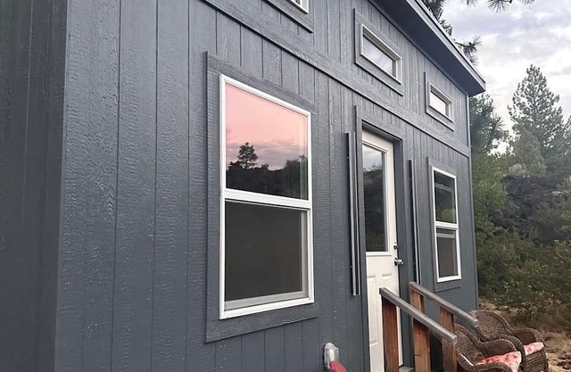 Adorable tiny home cozied up to lava rock!