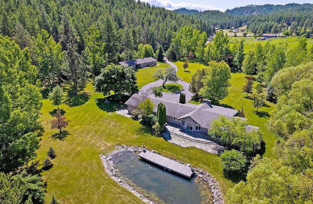 Private Flathead Lake lagoon and dock, enjoy a spacious 5-bedroom Lakeside home.