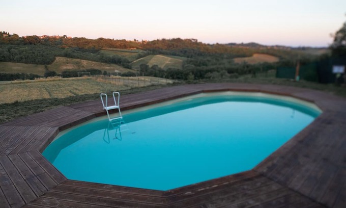 Monteriggioni Apartment | Holiday Apartment "Le Tre Pietre - Casa Fragola" with Balcony, Shared Pool & Wi-Fi