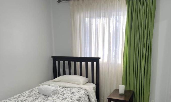 Brandon Apartment | Comfortable Stickney bedroom.
