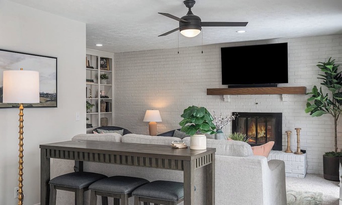 West Omaha House | Central Family Oasis, with Hot Tub & Fenced Yard!